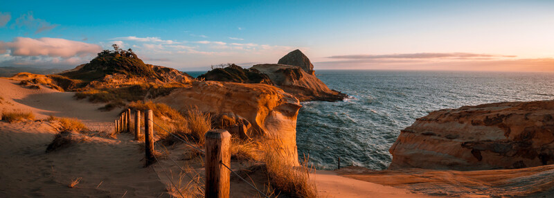 Cape Kiwanda State Park sandy trail during a vibrant colored sunset.