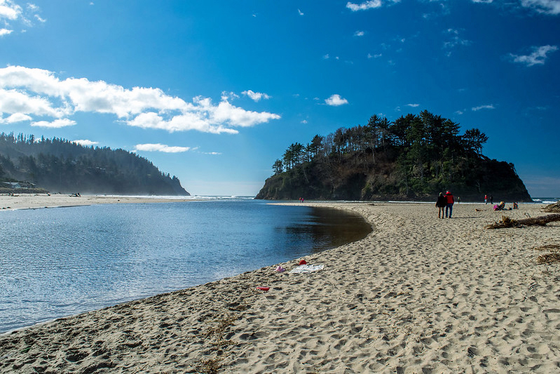 The beach and Proposal Rock in Neskowin on a sunny day.