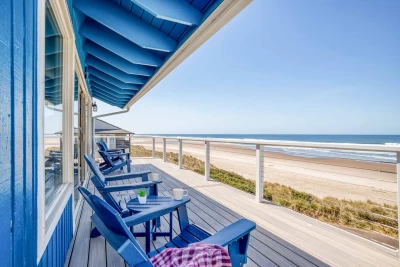Hot tub view from beachfront house with glass wind break.