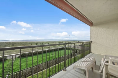 Balcony views overlooking the Seaside Prom, the trails to the beach, and the Pacific Ocean.