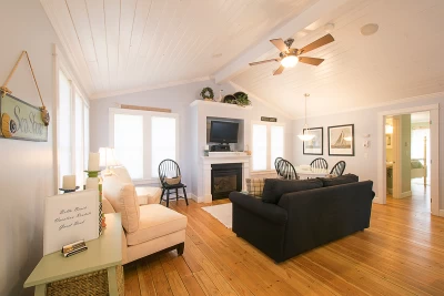 Nantucket-style cedar shake beach cottage, 1-level with white custom trim.