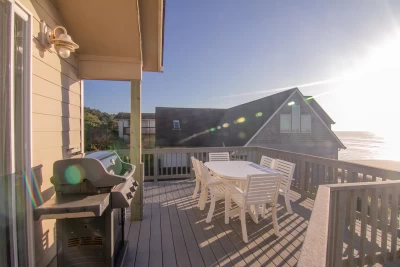 Ocean front view of vacation home in South Beach Oregon with BBQ and Outdoor Dining Table