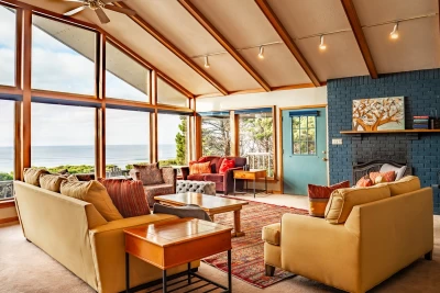 Ocean front vacation home living room / dining room area with ocean view