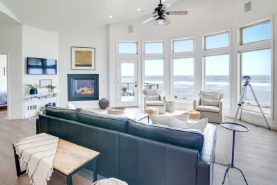Oceanfront view from The Coastal Jewel showing Pacific Ocean, sandy beach, and oceanfront deck