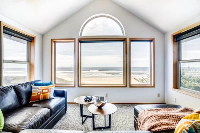 Oceanfront Sand Castle vacation home with expansive sandy beach, large deck, and panoramic Pacific Ocean views on the Oregon Coast